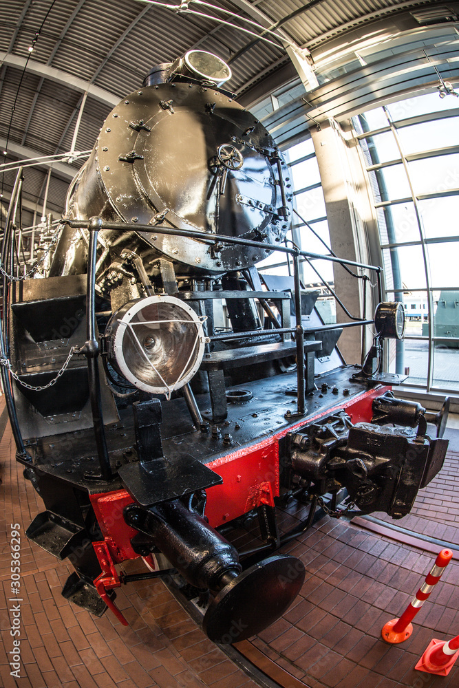 vintage black steam locomotive at the railway station