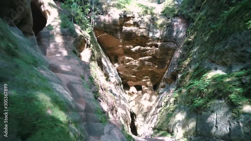 Licu - Langu Sandstone Cliffs. The Big Langu Cave. Sand Formations at Lode Behind Cesis in Latvia. Aerial Dron Shoot. photo