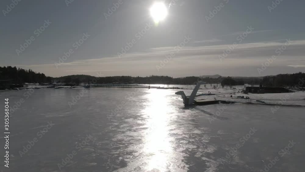 Outdoor diving tower by frozen water. One of a kind architecture. Drone hight Outdoor diving tower by frozen water. One of a kind architecture. Drone hight