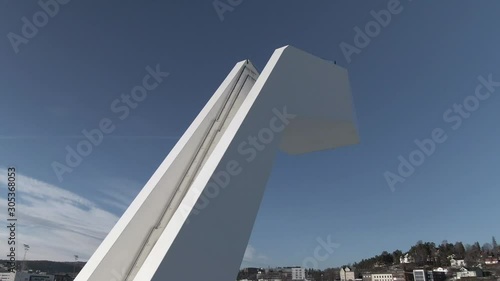 Outdoor diving tower by frozen water. One of a kind architecture. Drone closeup photo