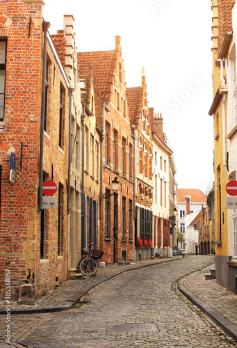 Street with historic medieval buildings  Bruges  Belgium