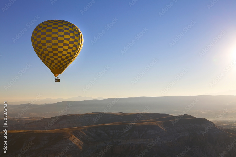 Fototapeta premium Hot air balloon flight in autumn in Cappadocia national Park. Valley of love. Meet the dawn.