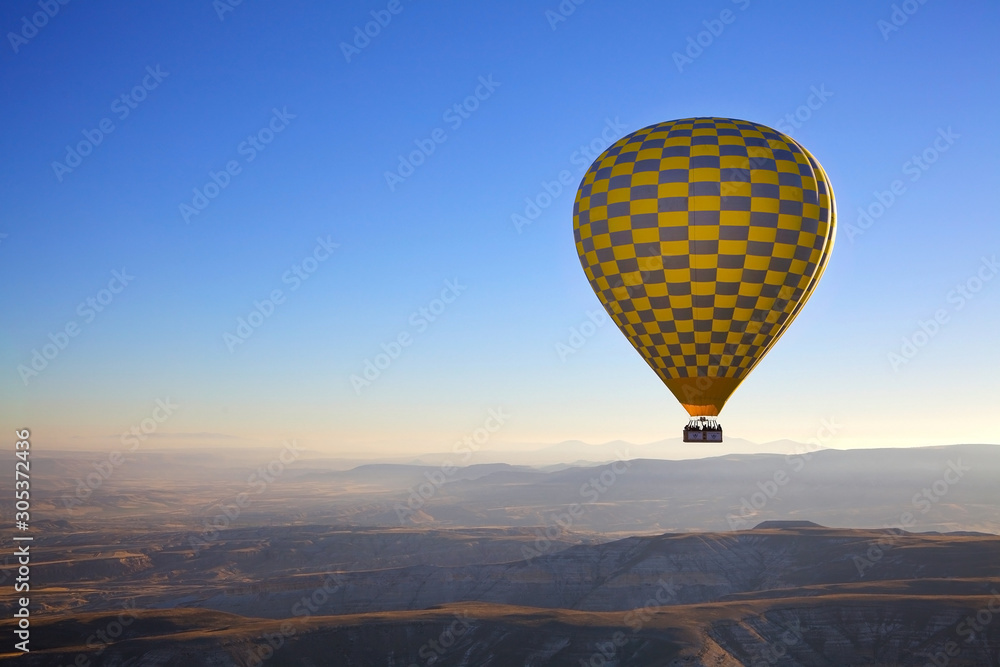 Fototapeta Hot air balloon flight in autumn in Cappadocia national Park. Valley of love. Meet the dawn.