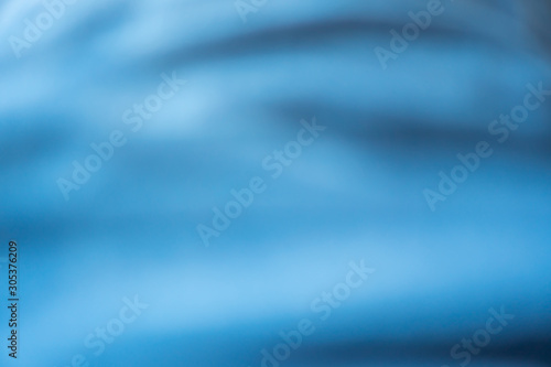 Blur blue silk fabric texture abstract background.