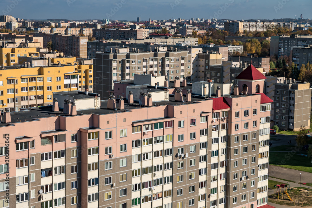 Panoramic view on new quarter high-rise building area urban development residential quarter in sunny autumn day from a bird's eye view.
