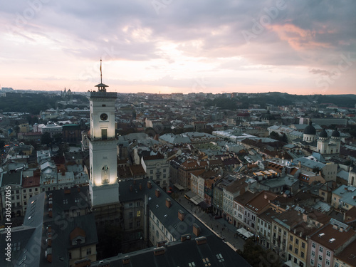 aerial view of lviv bell clock tower on sunset overcast sky