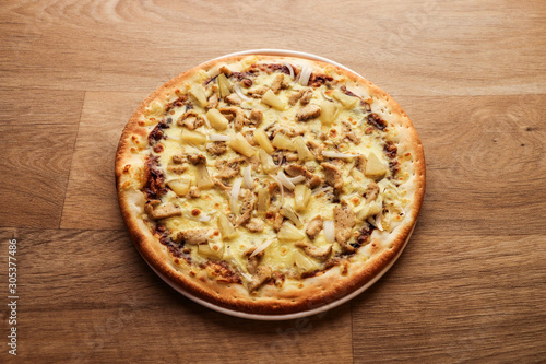 Pizza Hawaii - pineapple pizza on wooden background