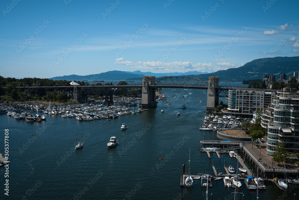 Panoramic view of granville island and  Burrard Street Bridge in Vancouver downtown, Cityscape with blue sky, BC, Canada