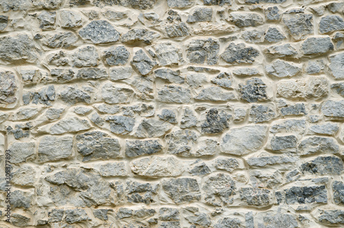 New gray stone wall close up