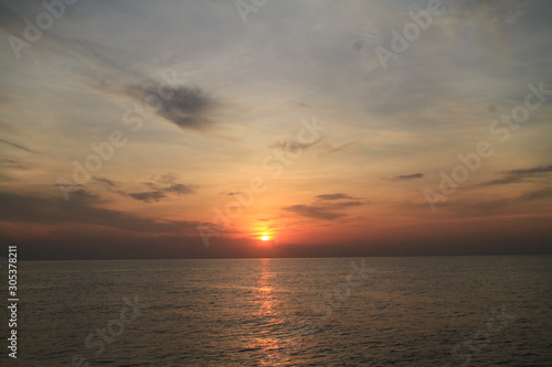 sunset over the sea © Pichit