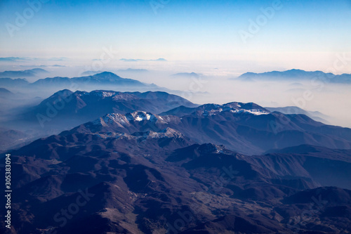 Aerial view of alps mountains covered with snow.
