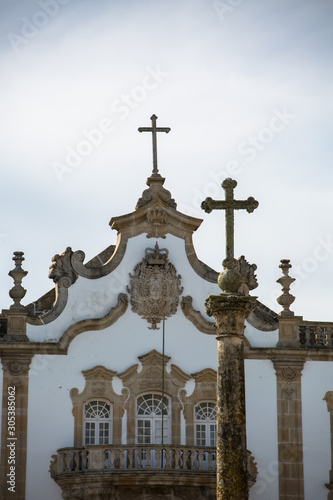 Detailed view at the pillory with a cross and the pediment cornice at the Church of Mercy, baroque style monument, architectural icon of the city of Viseu, in Portugal