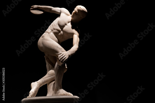Discus thrower discobolo statue isolated on black photo
