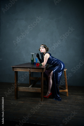 girl in evening blue dress with a cigarette