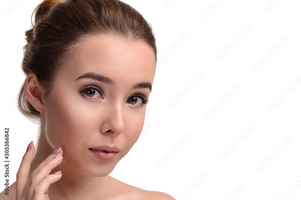 Beauty skin. Young beautiful woman with naked shoulders touching her face on white background. Girl with Clean Fresh Skin. Close up. Cosmetology. Skincare. Beauty & Skin care concept. Copy space Beauty skin. Young beautiful woman with naked shoulders touching her face on white background. Girl with Clean Fresh Skin. Close up. Cosmetology. Skincare. Beauty & Skin care concept. Copy space