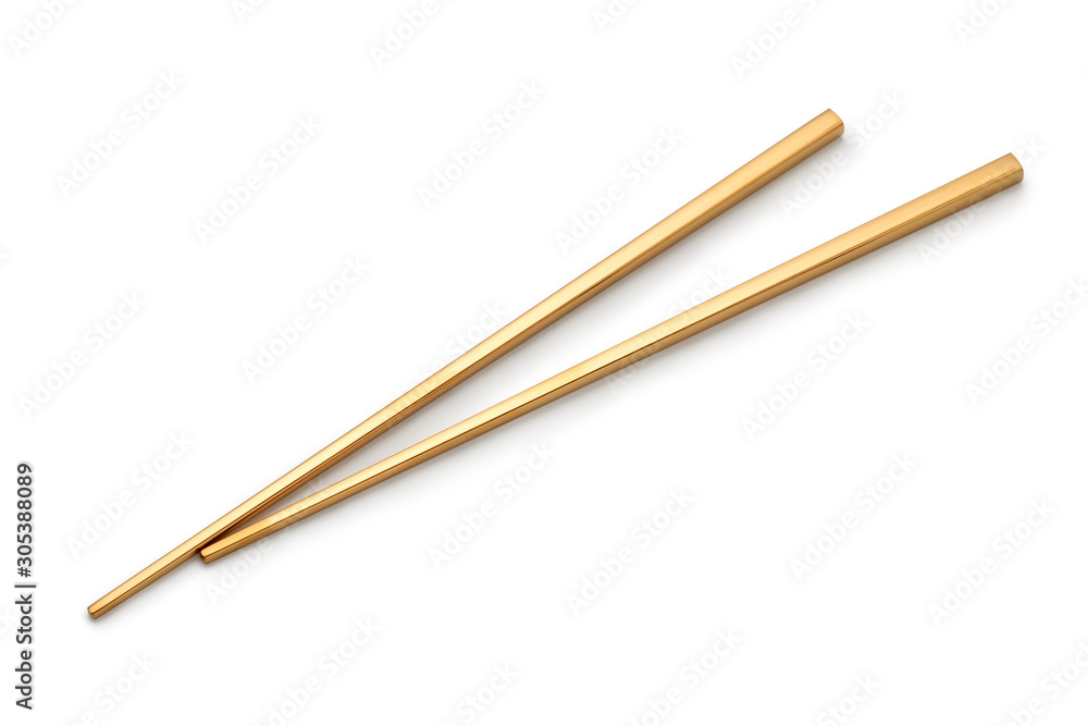 Golden chopsticks isolated on white background Golden chopsticks isolated on white background