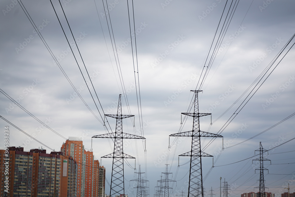 power transmission line in the city with cloudy sky power transmission line in the city with cloudy sky