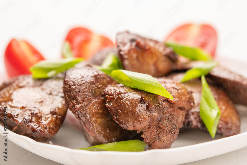 Homemade chicken liver fried with soy sauce, tomatoes, onions and spices