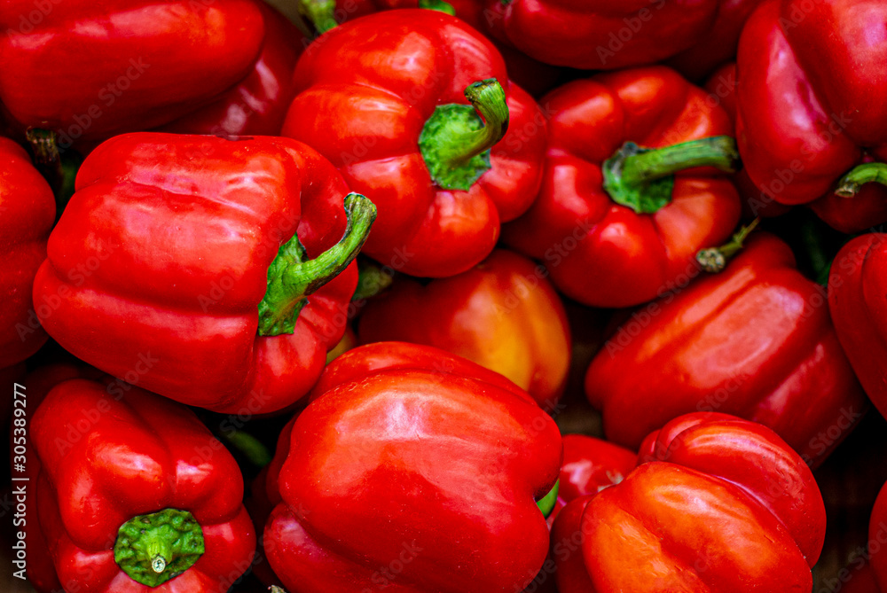 Red bell pepper close-up, wallpaper, pattern. A lot of ripe red pepper, the concept of the crop, veggie nutrition, vitamin food. Red bell pepper close-up, wallpaper, pattern. A lot of ripe red pepper, the concept of the crop, veggie nutrition, vitamin food.