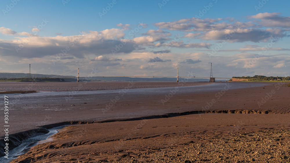 The River Severn with Severn Bridge in the background, seen from Redwick, South Gloucestershire, England, UK