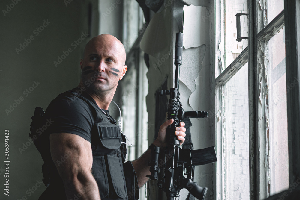 Concept photo of special agent man with a rifle. Person with airsoft gun. Thriller film concept. Concept photo of special agent man with a rifle. Person with airsoft gun. Thriller film concept.