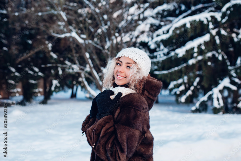 Happy afro american girl in park in winter sunny day Happy afro american girl in park in winter sunny day