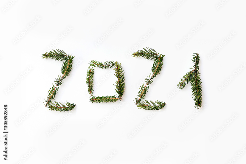 Number of new year 2021 made of fir branches. Flat lay, top view Number of new year 2021 made of fir branches. Flat lay, top view