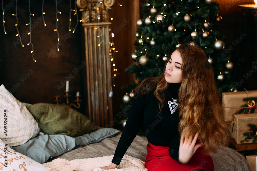 Portrait of girl near Christmas tree in photo studio. Christmas New Year. Portrait of girl near Christmas tree in photo studio. Christmas New Year.