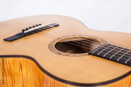 wood texture of lower deck of six strings acoustic guitar on white background. guitar shape
