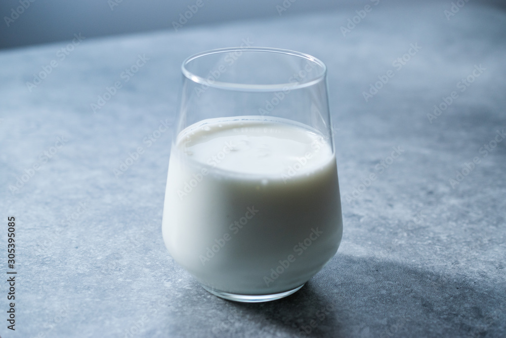 Organic Probiotic Milk Kefir Yogurt in Glass Cup Ready to Drink. Organic Probiotic Milk Kefir Yogurt in Glass Cup Ready to Drink.