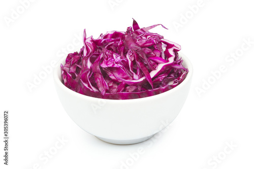 Fotografija Sliced red cabbage in ceramic bowl on a white background with clipping path