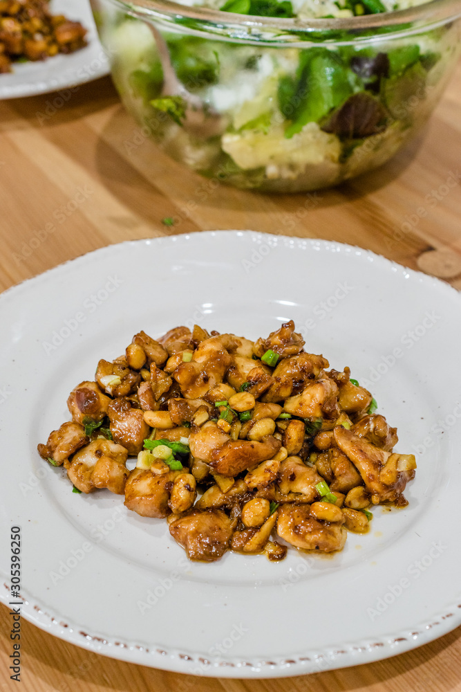 Homemade Kung Pao Chicken with Peanuts, Peppers, Soy Sauce, Green Chives and Veggies. Homemade Kung Pao Chicken with Peanuts, Peppers, Soy Sauce, Green Chives and Veggies.