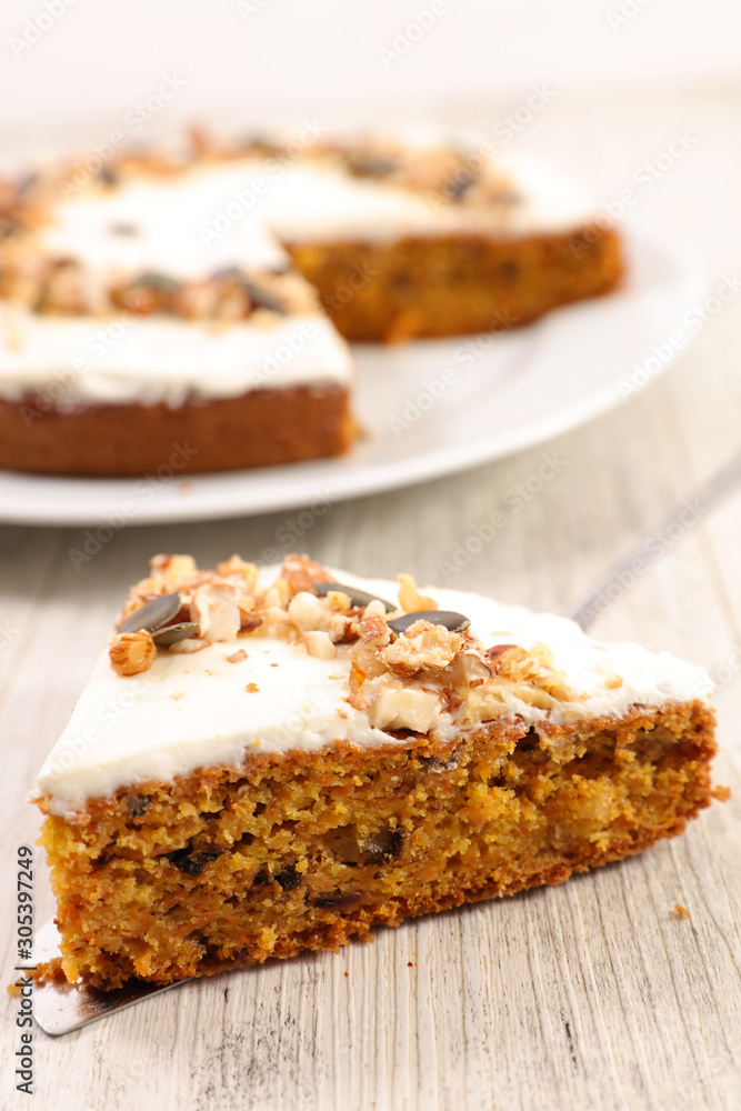 carrot cake with cream and nuts, slice