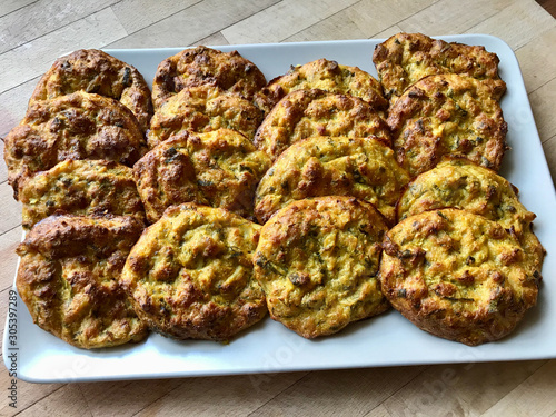 Mucver / Traditional Turkish, Greek Zucchini Meal Dish with Curry and Dill in Plate. photo