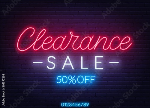 Clearance sale neon sign on dark background.