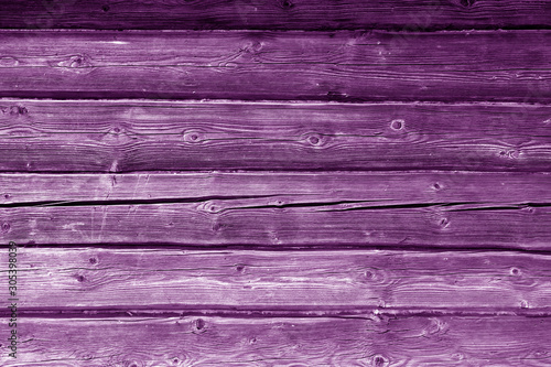 Old grungy wooden planks background in purple color.