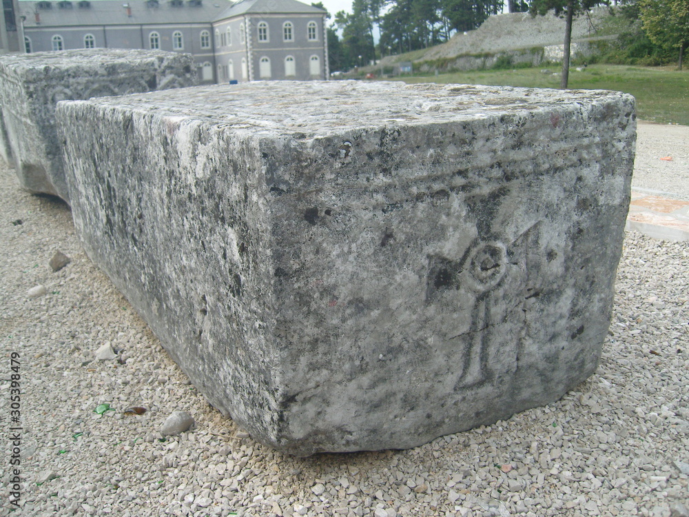 Medieval tombstone Stecak with cross Niksic Montenegro Medieval tombstone Stecak with cross Niksic Montenegro