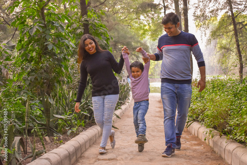 happy family walking  in the park