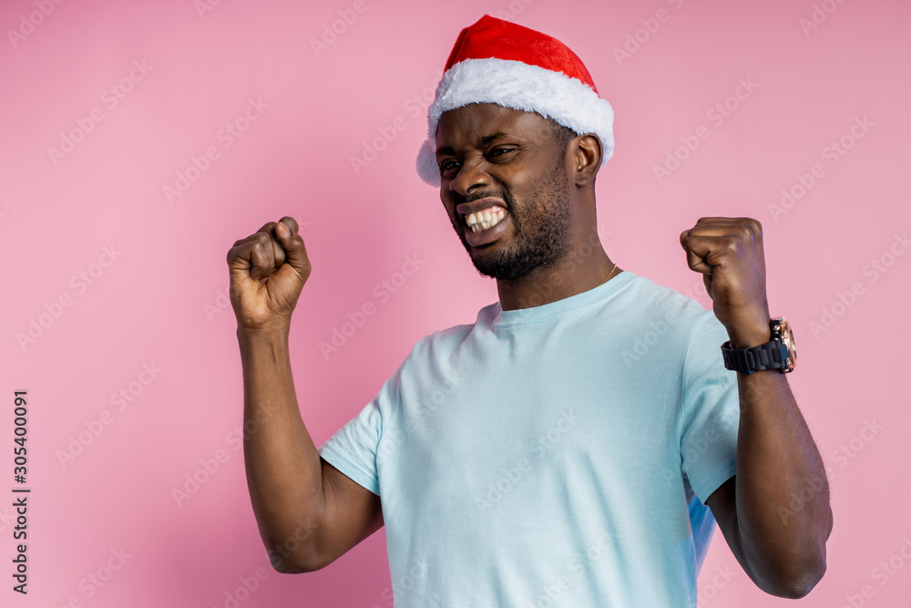 African american man wearing Santa hat African american man wearing Santa hat