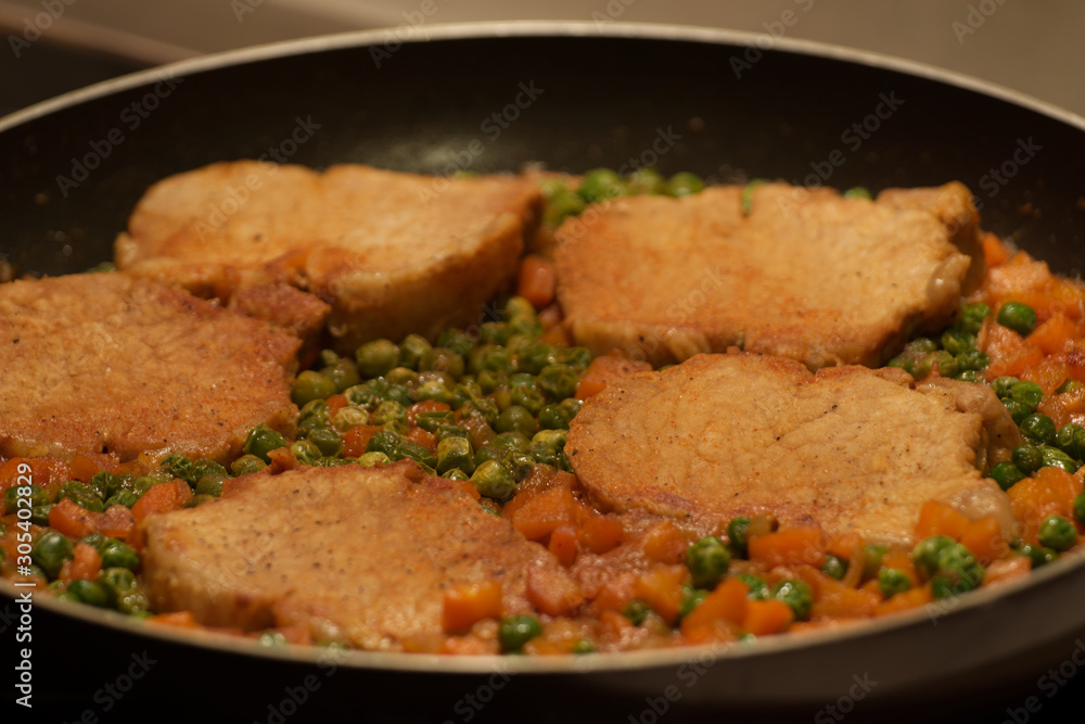 Meat with peas and carrots