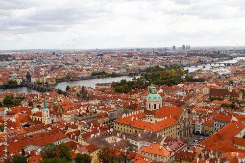 City views Prague autumn. Tiled roofs. The Charles Bridge. Vlatva river