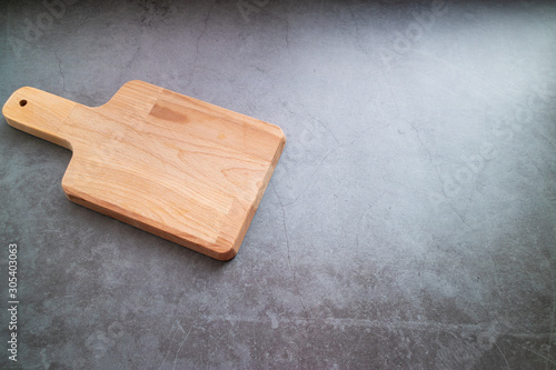 Wooden table on concrete background. Copy space. Top view.