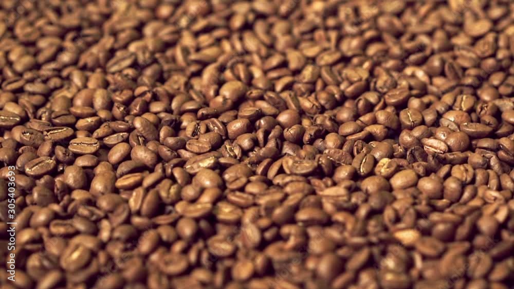 Coffee beans background, rotating top view Coffee beans background, rotating top view