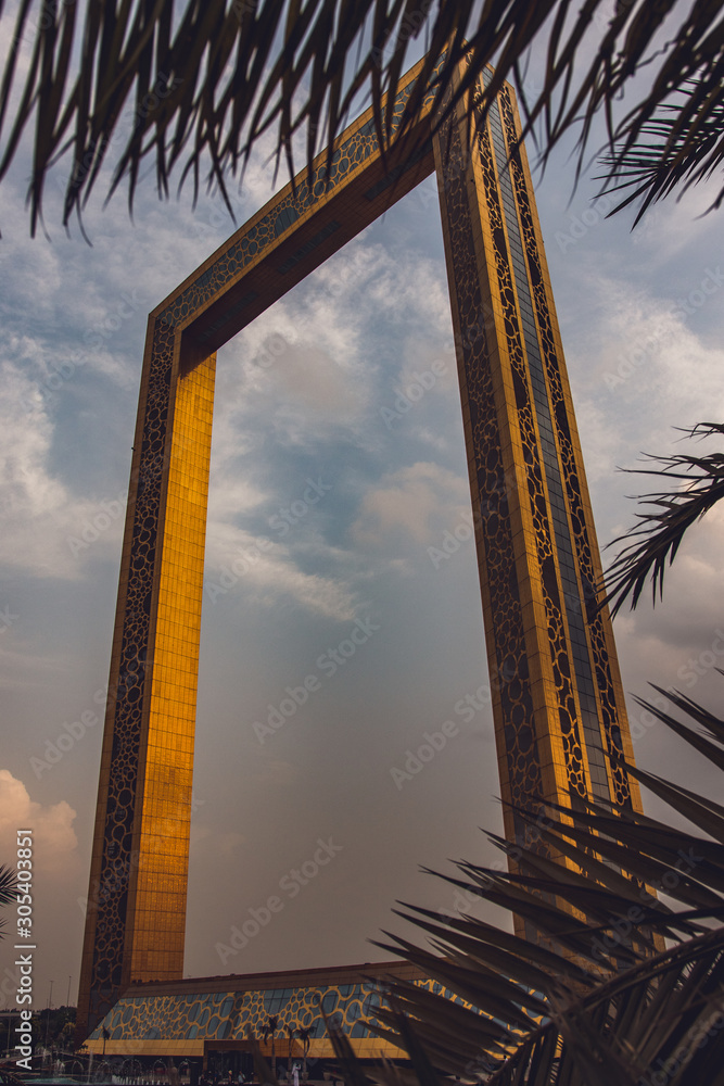 Dubai Frame  with palm leaves 