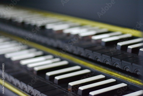 Keyboard of harpsichord (selective focus), Detail on a harpsichord keyboard. Baroque musical instrument. photo