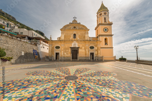 A view across the Piazza San Gennaro in in the little town, in Southern Italy Praiano, on the Amalfi coast. Church of San Luca Evangelista, Praiano, Province of Salerno, Campania, Italy. photo