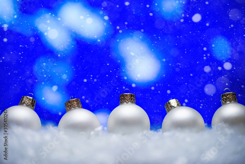 Christmas, bright background with falling snow. New Year's toys. Toys. Discounts and rose sales. © Anton