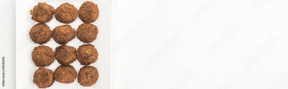 top view of falafel balls on plate on white background, panoramic shot top view of falafel balls on plate on white background, panoramic shot