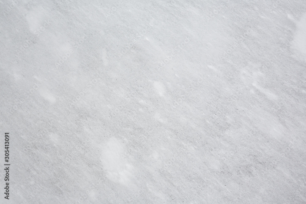 Fototapeta premium A stone covered with a thin layer of snow