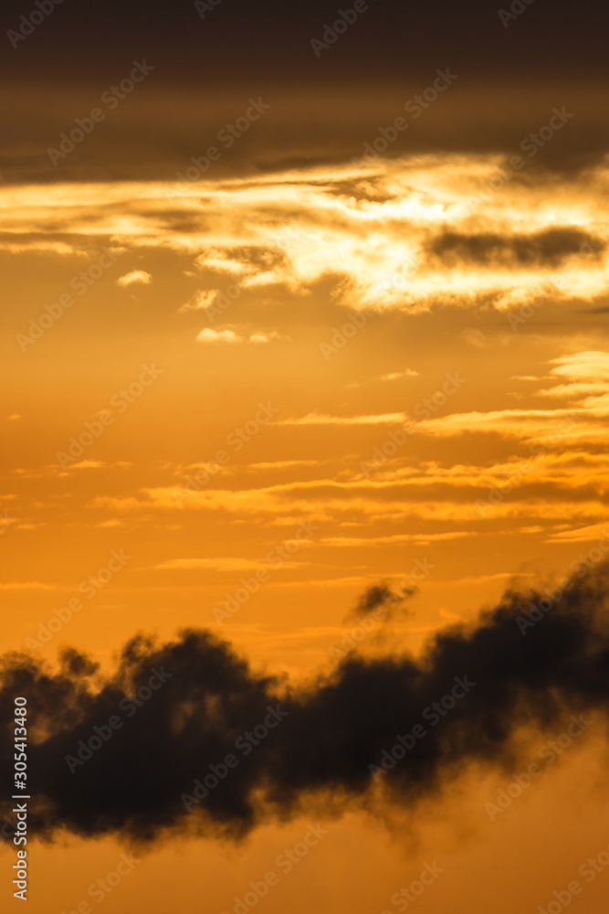 Fantastic clouds at sunrise, vertical panorama